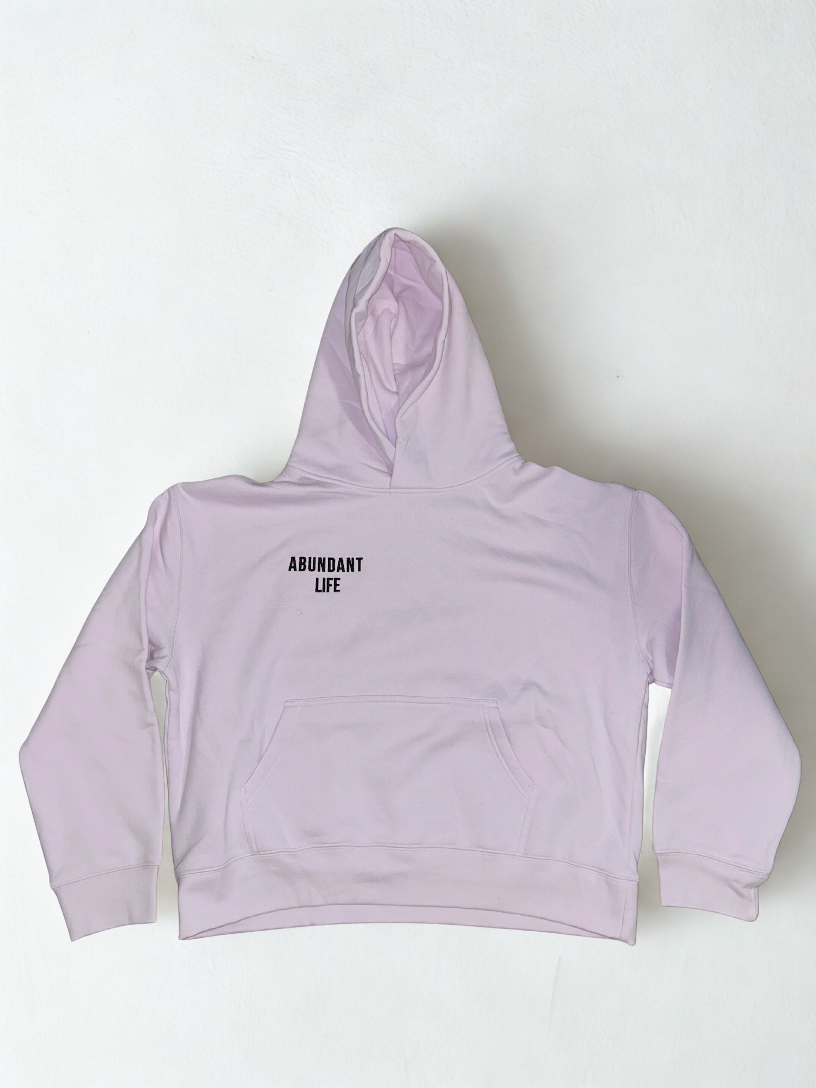 Pink high-waisted bikini bottom with a brand logo on a white background